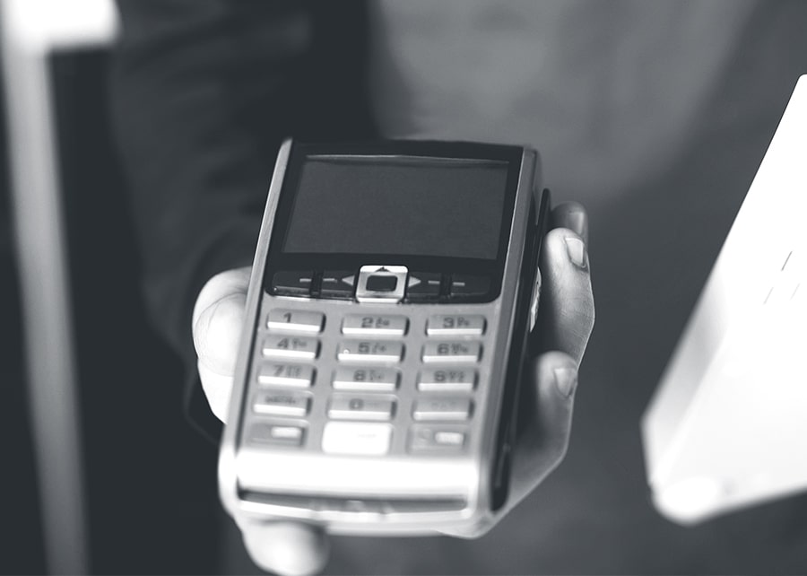 Hand extended to present card processer